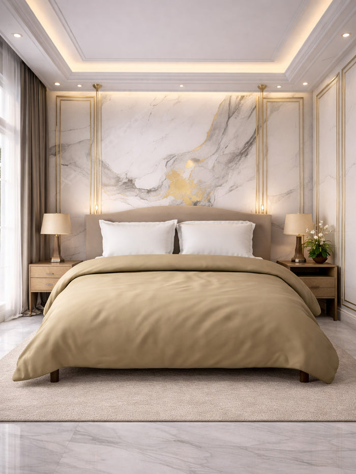 Modern bedroom with marble accent wall, beige bedding, and side tables.