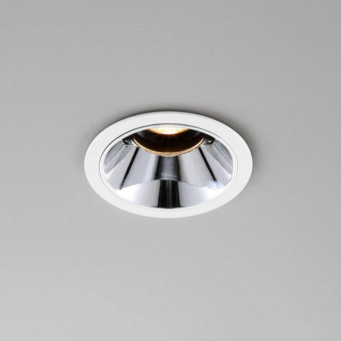 polished chrome downlight installed on a grey ceiling