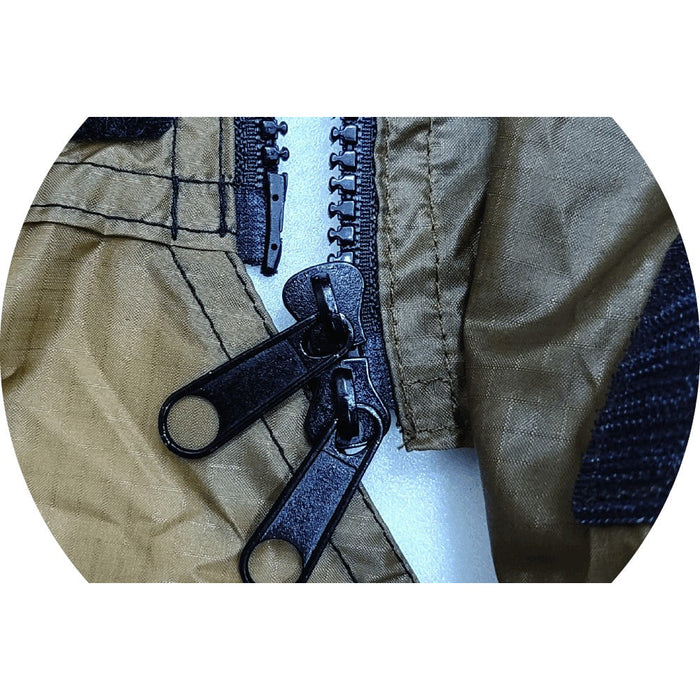 Close-up of dual black zipper sliders fastening the Gopamir G450 body TPU door to tan ripstop fabric