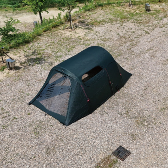 Overhead rear angle of the dark green Gopamir TN600 tunnel tent with TPU windows and open side vent on gravel ground