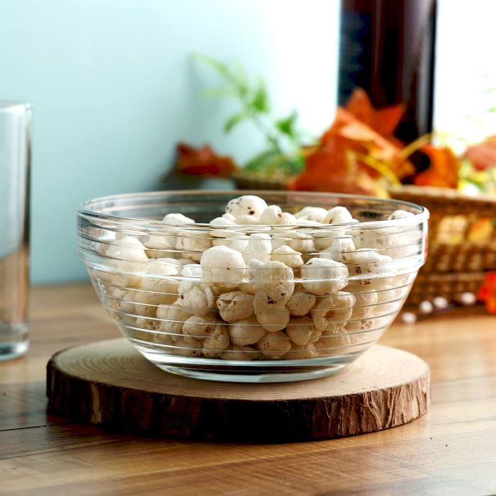 Kyklos glass bowls filled with mixed makhana ingredients.