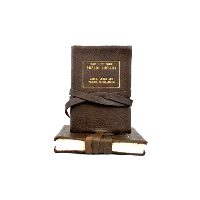 Leather journal with The New York Public Library gold stamp, tied with string.