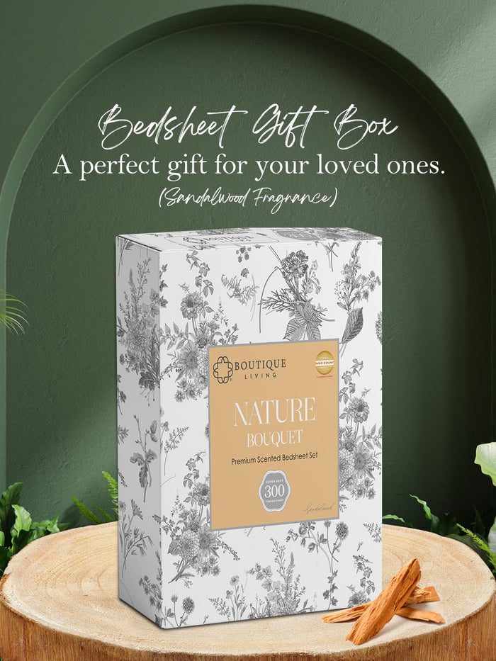 Bedsheet gift box with floral design on a wooden surface and green background