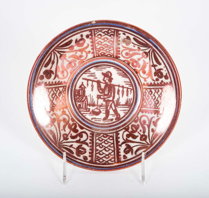 Ruby Lustre Ware Plate with Man Carrying Bird on a Stick