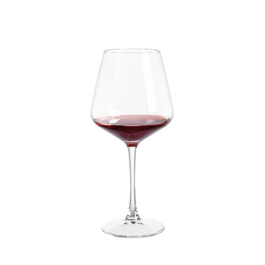 Beautiful crystal red wine glasses displayed on a modern table.